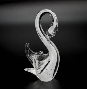 White Swan Figurine: White Swan Figurine  Graceful and serene, this White Swan figurine is handcrafted using the Sommerso technique, a hallmark of Murano glass artistry. Layers of luminous white glass are encased in cryst