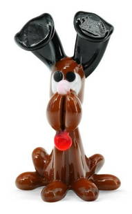 Brown Dog Miniature Murano Sculpture: Brown Dog Miniature Murano Sculpture  Charming and full of character, this Murano glass brown dog miniature is expertly hand-sculpted with warm amber tones and lifelike detail. Crafted in Murano using