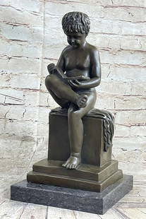 Young Boy Reading Bronze Sculpture: Young Boy Reading Bronze Sculpture  What a joy it is to see young Boy enjoy a book! This sweet little boy stands smartly with a book on her lap. He is entranced in the novel that is coming to life in