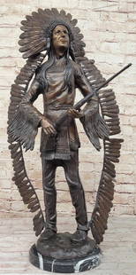Native American Holding Rifle Inspired Bronze Statue - 30" x 16": Native American Holding Rifle Inspired Bronze Statue - 30&#34; x 16&#34;  This bronze statue depicts a Native American figure standing upright, holding a rifle in both hands. The intricate detailing o