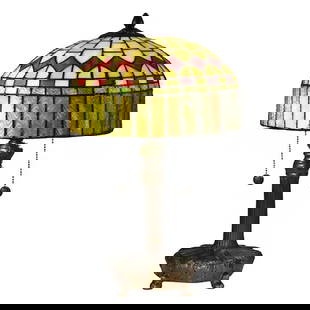 Mayor Island Handcrafted Tiffany Table Lamp: Mayor Island Handcrafted Tiffany Table Lamp  The Mayor Island Handcrafted Tiffany Table Lamp features a stunning stained glass shade with a mosaic of warm yellows, ambers, and hints of red. The dome-s