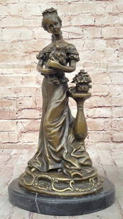 French Victorian Lady with Dog Bronze Sculpture by Miguel Lopez - 16" x 8.5": French Victorian Lady with Dog Bronze Sculpture by Miguel Lopez - 16&#34; x 8.5&#34; This charming bronze sculpture beautifully depicts a French Victorian-style lady tenderly holding her beloved dog,