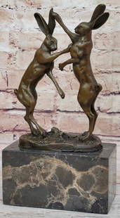A Dynamic Duel of Hares' Strength Milo Reproduction Bronze Sculpture - 10" x 5": A Dynamic Duel of Hares&#39; Strength Milo Reproduction Bronze Sculpture - 10&#34; x 5&#34;  Introducing a captivating bronze sculpture that portrays a unique interaction between two hares, transcendi