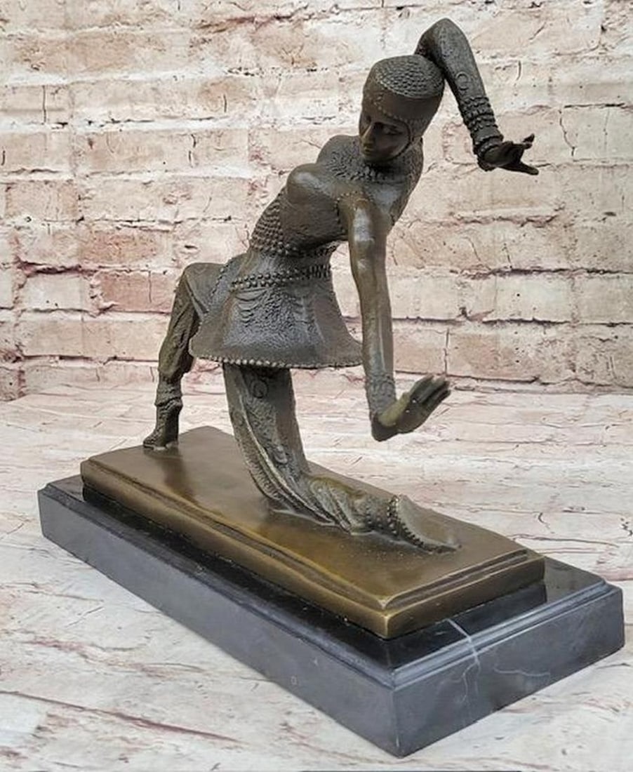 VINTAGE SIGNED KAMONA DANCER INSPIRED BY D.H DIMITRUS BRONZE STATUE ANTIQUE FIGURE: VINTAGE SIGNED KAMONA DANCER INSPIRTED BY D.H DIMITRUS BRONZE STATUE ANTIQUE FIGURE Experience the captivating beauty of this bronze sculpture, showcasing a graceful dancer in the midst of a mesmeriz