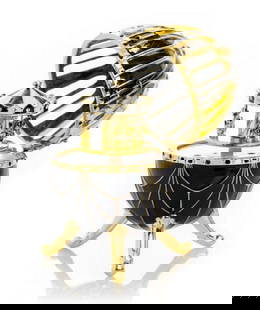 Black and Gold Faberge Inspired Egg with Horse Carousel: Black and Gold Faberge Inspired Egg with Horse Carousel  Handmade Trinket Box Decorated with Austrian Crystals and Gold Plated. Plays the melody of Fur Elise by Ludwig Van Beethoven. A splendid handma