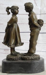 Young Love Bronze Sculpture Signed by Milo - 10" x 6": Young Love Bronze Sculpture Signed by Milo - 10&#34; x 6&#34;  Transport yourself back to the tender moments of youth with this heartwarming bronze sculpture capturing the innocence of first love. A b