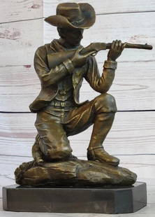 Figure of a Kneeling Ranger With Rifle Bronze Sculpture: Figure of a Kneeling Ranger With Rifle Bronze Sculpture  Here is a wonderful sculpture of a Cowboy shooting a rifle in the old west, in mid-run shooting range with his arch enemy. The detail of this s