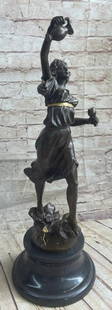Woman Carrying Water Jug Bronze Sculpture: Woman Carrying Water Jug Bronze Sculpture  A classical bronze sculpture depicting a lady holding a jug and cup of vine. The bronze sculpture was produced using the lost-wax technique allow