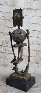 Robot Skeleton Bronze Statue Sculpture: Robot Skeleton Bronze Statue Sculpture  This abstract sculpture is a great conversation piece. There is profile of a person is smoothly carved onto a stone rock. The contradicting style of the smooth,