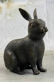 Sitting Bunny Bronze Statue: Sitting Bunny Bronze Statue  This cute bunny looks up with the sweetest look and taking a brake from a long day. This little rabbit is the perfect touch of decor for a sweet and loving home. His ears