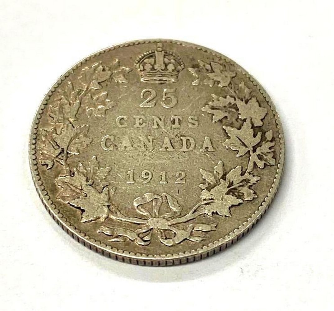 1912 Canadian 25 Cent Coin: Obverse The portrait in left profile of George V is surrounded with the inscription "GEORGIVS V DEI GRA: REX ET IND:IMP" (George V, King and Emperor of India by the grace of God) Lett