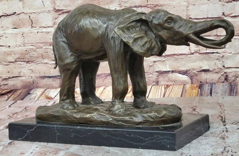 Wild African Elephant Original Bronze Statue - 9.5"  x 13": Wild African Elephant Original Bronze Statue - 9.5&#34; x 13&#34;  This signed bronze elephant sculpture by Milo embodies strength and elegance. Cast using the lost wax method, its rich brown patina e