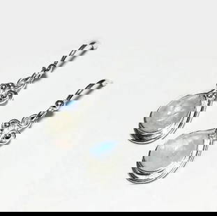 Rainbow Moonstone Drop Earrings: Rainbow Moonstone Drop Earrings These Rainbow Moonstone Drop Earrings feature the ethereal glow of moonstone, with flashes of iridescent blue and white that shift with movement. Known for its connect