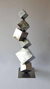 Cubist Metal Tower Sculpture: Cubist Metal Tower Sculpture This striking cubist metal sculpture explores the interplay between order and chaos through a dynamic arrangement of six interlocking cubes. Designed in an industrial mode