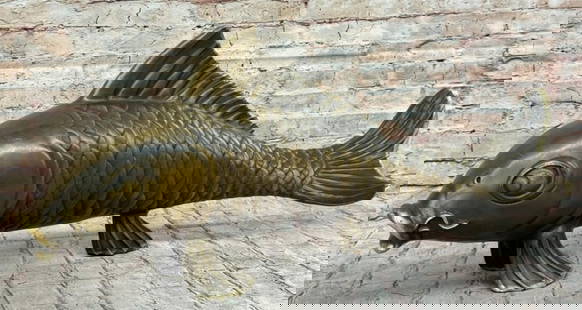 Bronze Koi Carp Sculpture: Bronze Koi Carp Sculpture  Elegant and serene, this bronze sculpture signed by the artist Marius, captures the timeless beauty of a koi carp gliding through imagined waters. With gently curved fins, f