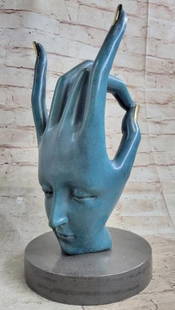 Hand of Surreal Reflection Blue Patina Bronze Sculpture: Hand of Surreal Reflection Blue Patina Bronze Sculpture  A captivating reproduction bronze sculpture inspired by the visionary imagination of Salvador Dalí. This surreal piece features an outstretche