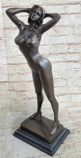 Sexy Girl Bronze Sculpture: Sexy Girl Bronze Sculpture  This striking bronze sculpture captures the iconic allure of a Playboy Bunny centerfold in a dynamic and seductive pose. The female figure stands confidently with her back