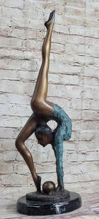 Acrobat Gymnast Bronze Sculpture: Acrobat Gymnast Bronze Sculpture  This floor gymnast shows off her skills as she does a perfect back bend and gracefully extends her leg straight up and vertically. She shows an amazing skill of flexi