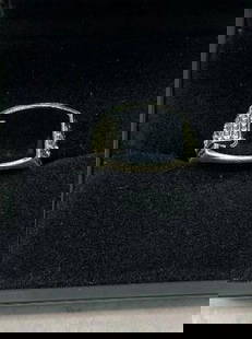 Sterling Silver Ring with Black Square Stone and White Gem Accents: Sterling Silver Ring with Black Square Stone and White Gem Accents  Striking in contrast and design, this sterling silver ring showcases a bold square-cut black stone as its centerpiece, framed by spa