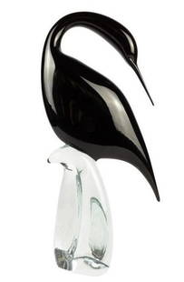 Murano Glass Black Female Heron: Murano Glass Black Female Heron  Graceful and poised, this Black Heron Female sculpture is a stunning example of Murano glass artistry. Handcrafted in Italy, the sculpture features sleek black glass w