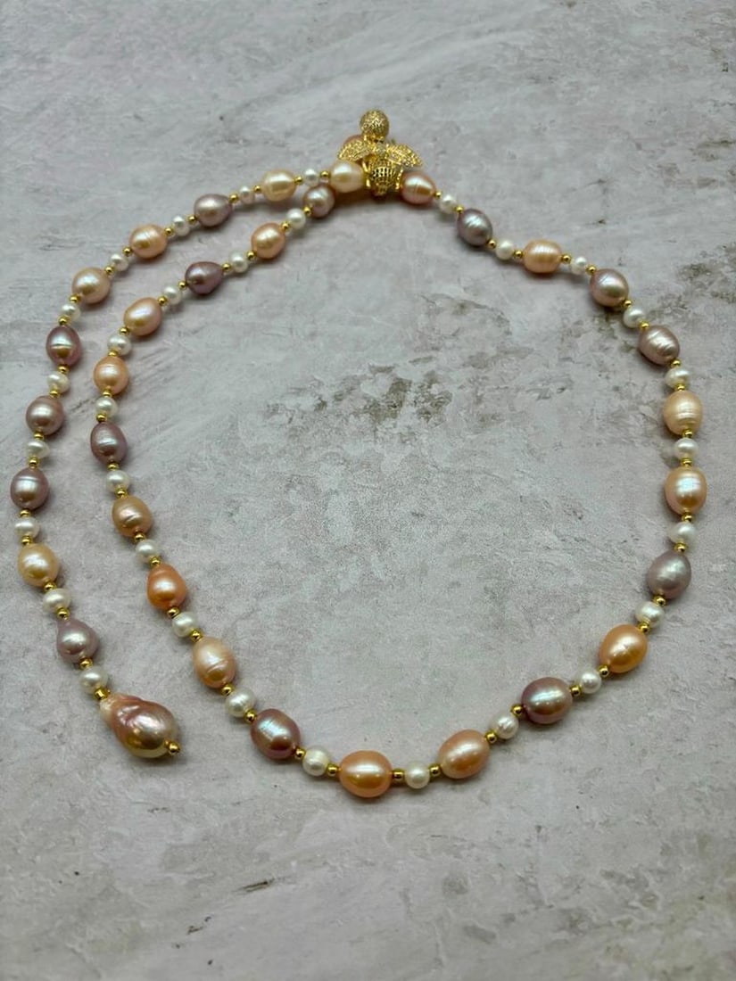 31" White, Pink, & Lavender Beaded Cultured Pearl Necklace: 31" White, Pink, & Lavender Beaded Cultured Pearl Necklace This exquisite piece features a harmonious blend of white, pink, and lavender cultured pearls, meticulously strung together to create