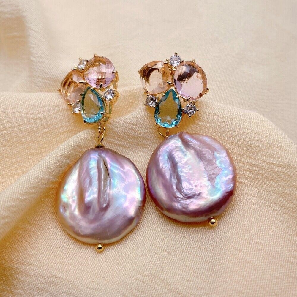 Natural Freshwater Purple Pearl 21mm Drop Stud Earrings: Natural Freshwater Purple Pearl 21mm Drop Stud Earrings Add a touch of elegance to your ensemble with these stunning Natural Freshwater Purple Pearl Drop Stud Earrings. Each earring features a captiva