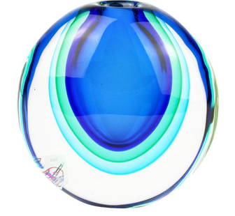 Light Blue Egg Vase – Murano Glass Sommerso Technique: Light Blue Egg Vase – Murano Glass Sommerso Technique  This handmade vase is crafted with exceptional artistry. A core of blue glass is layered with light green, followed by a final layer of light b