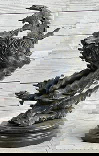 Celtic Moon Wolf Bronze Sculpture by M. Lopez - 16" x 10": Celtic Moon Wolf Bronze Sculpture by M. Lopez - 16" x 10" This bronze sculpture by Miguel Lopez features a howling wolf embraced by a Celtic crescent moon. Crafted using the lost-wax method