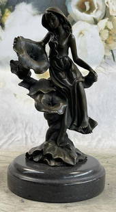Girl Resting on Flower Bronze Statue: Girl Resting on Flower Bronze Statue  Get lost in a daydream. She leans back on a tree stump and flowers grow all around her. She stretches an arm out to feel the blossom graze her skin. She is one wi