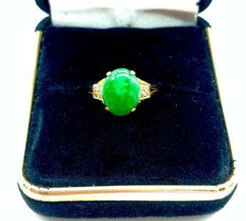 14K Gold and Natural Jade Birthstone Style Ring: 14K Gold and Natural Jade Birthstone Style Ring   Set with an oval cut Jadeite Stone and 8 round cut Diamonds.   Jade Total Carat Weight: 0.96ct   Diamond Total Carat Weight: 0.01ct   Please view phot