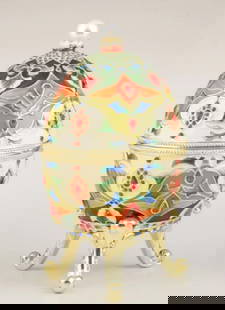 Kaleidoscopic Russian Faberge Treasure Egg: Kaleidoscopic Russian Faberge Treasure Egg  Embark on a journey of cultural opulence with our Kaleidoscopic Russian Faberge Treasure Egg, a handcrafted masterpiece plated with 24K Gold. Inspired by Ru