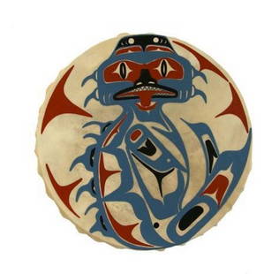 Dogfish Spirit Drum: Dogfish Spirit Drum  Handcrafted from natural deer hide and wood, this traditional Indigenous drum carries deep cultural significance. The taut hide produces a resonant, earthy tone, while the sturdy