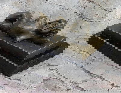 Bronze Sculpture of A Nude Female Model Posing Beautifully - 5" x 12": Bronze Sculpture of A Nude Female Model Posing Beautifully - 5&#34; x 12&#34;  The nude beauty reclines on her left side, adorned with a serene smile of quiet bliss. Her pose exudes a naturalistic cha
