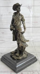 Cowboy Carrying Horse Saddle Bronze Statue - 13" x 6": Cowboy Carrying Horse Saddle Bronze Statue - 13" x 6" This sculpture features a traditional cowboy wearing a hat and necklace, holding a saddle in his left hand. The jacket has