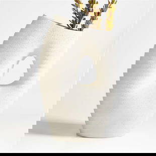 Textured White Ceramic Clyborne Vase 16": Textured White Ceramic Clyborne Vase 16&#34; The amorphous shape, unique texture, and artisanal quality of the Clyborne white vase allow it to stand as a striking piece of modern sculpture. Modeled wi