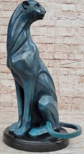 Mountain Lion Bronze Sculpture in Green Patina: Mountain Lion Bronze Sculpture in Green Patina  Powerful and poised, this bronze reproduction sculpture captures the raw elegance of a mountain lion, bearing the signature of renowned artist Henry Moo