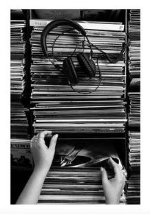 Through The Archives Black & White Poster Print: Through The Archives Black &amp; White Poster Print  Going through the vinyl archives. Black and white photograph of vinyl records. Monochrome photograph of a woman going through an archive of vinyl r