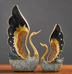 Pair of Black and Gold Swans Figurine Set: Pair of Black and Gold Swans Figurine Set  These swans are inspirational art pieces that sets a refined tone in your home. The attention to detail in each swan, adds an elegant and authentic style to