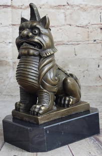 Embodying Feng Shui Grace Erte's Guardian Foo Dogs Guardian Lion Door Statue - 7.5" x 5": Embodying Feng Shui Grace Erte's Guardian Foo Dogs Guardian Lion Door Statue - 7.5" x 5" Experience the regal aura of this bronze sculpture featuring the revered "Foo Dog" – the