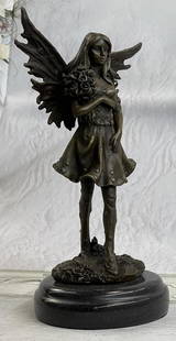 Fantasy Fairy Bronze Sculpture: Fantasy Fairy Bronze Sculpture  This adorable angel of love will go perfectly in any room of your or a friends house. She stand gracefully holding a bouquet of roses on her right arm. Her