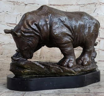 Signed Milo Original African Rhinoceros Bronze Sculpture On Marble Base - 9" x 14": Signed Milo Original African Rhinoceros Bronze Sculpture On Marble Base - 9&#34; x 14&#34;  Journey back in time and witness the awe-inspiring presence of the rhinoceros with this extraordinary bronze