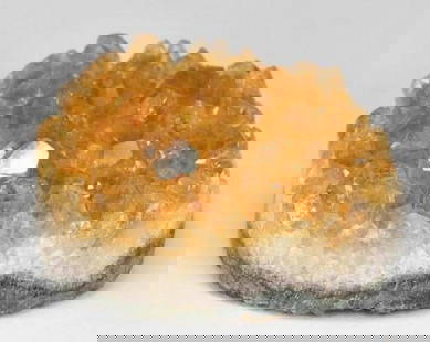 Radiant Honey Orange Druzy Citrine: Radiant Honey Orange Druzy Citrine  Bursting with golden warmth, this striking Druzy Citrine features a fancy-shaped crystal cluster that glows in rich honey orange hues. A natural formation of sparkl