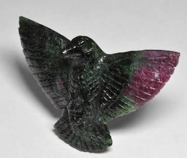 Multicolor Ruby-Zoisite Gemstone Carved Bird: Multicolor Ruby-Zoisite Gemstone Carved Bird  Expertly carved from natural Ruby-Zoisite, this loose gemstone takes the graceful form of a bird in mid-perch. A vivid blend of deep black, rich ruby red,