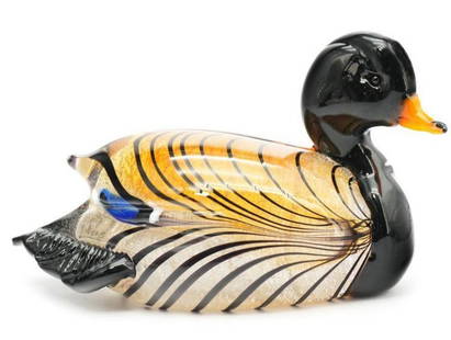 Murano Art Glass Duck: Murano Art Glass Duck  This elegant Murano glass duck figurine showcases the timeless beauty of Venetian glass artistry. Handcrafted by skilled artisans, the duck features smooth contours, rich color