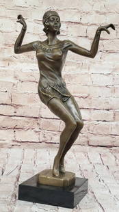 Roaring 50's Dancer Inspired Bronze Statue - 16" x 10": Roaring 50&#39;s Dancer Inspired Bronze Statue - 16&#34; x 10&#34;   This elegant bronze sculpture captures a dancer’s grace as she balances on her toes, arms extended. Her short dress highlights he