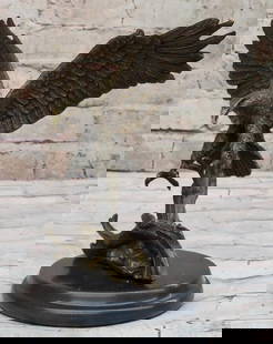 Bronze Eagle Inspired Sculpture by Barye - 8" x 9": Bronze Eagle Inspired Sculpture by Barye - 8&#34; x 9&#34;  This captivating bronze sculpture by the renowned artist Barye beautifully captures a small eagle descending with grace and power, poised fo