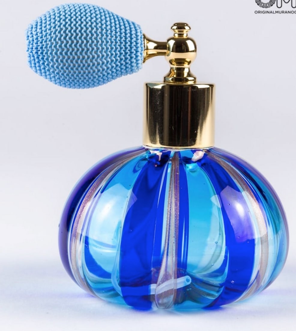 Blue Murano Glass Perfume Bottle: Blue Murano Glass Perfume Bottle Little blue bottle handmade with the technique of blown glass and avventurine. A very good elegant piece perfect to add to a perfume collection. Dimensions: 10 cm