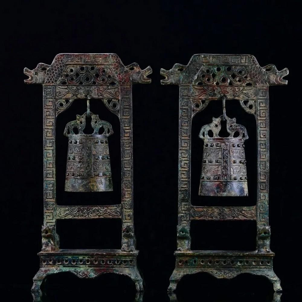 Pair of Antique Bronze Wall Clock Statue: Pair of Antique Bronze Wall Clock Statue This exquisite Chinese antique wall clock combines functional timekeeping with intricate artistry. Handcrafted from pure bronze, the clock features fine detai