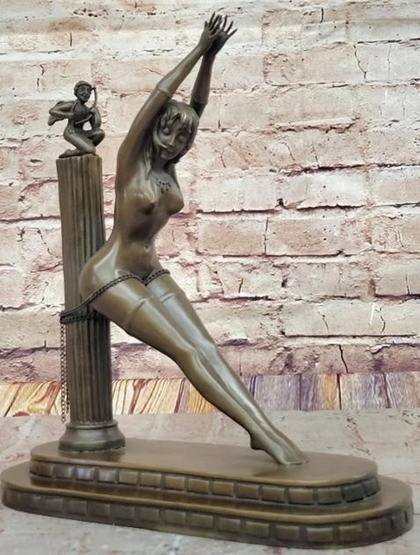 Chained Elegance Reproduction Bronze Sculpture: Chained Elegance Reproduction Bronze Sculpture A dramatic and stylized reproduction bronze sculpture bearing the signature of renowned Art Deco artist Erté. This captivating piece features a nude wo
