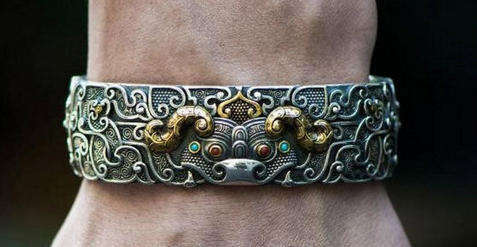 Taotie Bangle – Myth Woven in Mongolian Silver: Taotie Bangle – Myth Woven in Mongolian Silver The *Taotie Bangle* embodies the mystique of Mongolian folklore through its intricate portrayal of the legendary Taotie—a mythical guardian said to